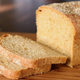 Loaf of Anadama bread with two slices on cutting board